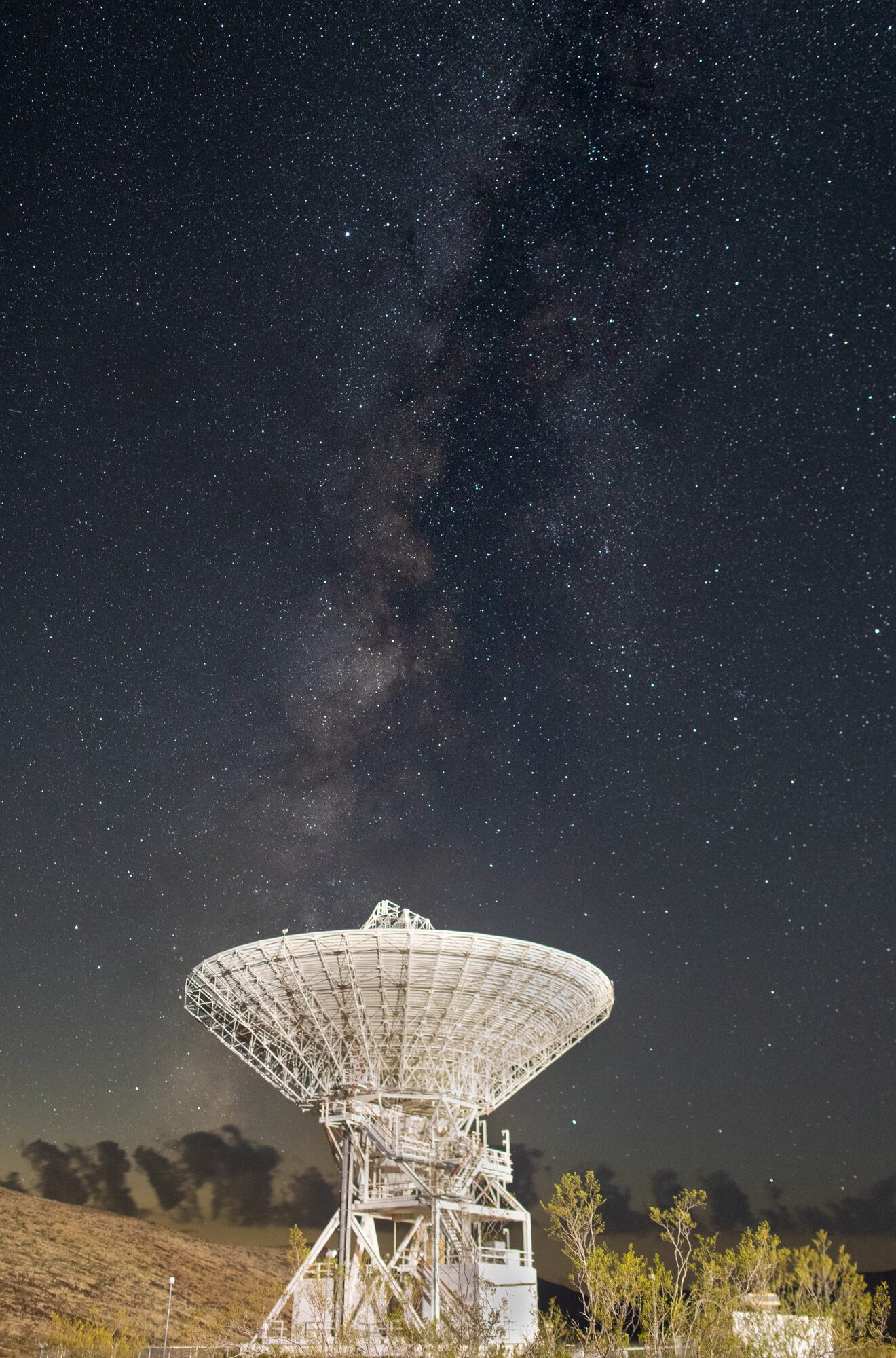 *   **Dish Gazes Milky Way: Echoes of Ingenuity**
*   **Cosmic Listener Against Starry Tapestry**
*   **Deep Space Dish, Galactic Backdrop, Human Ingenuity**
*   **Sentinel Dish, Cosmic Whispers, Earthly Echoes**