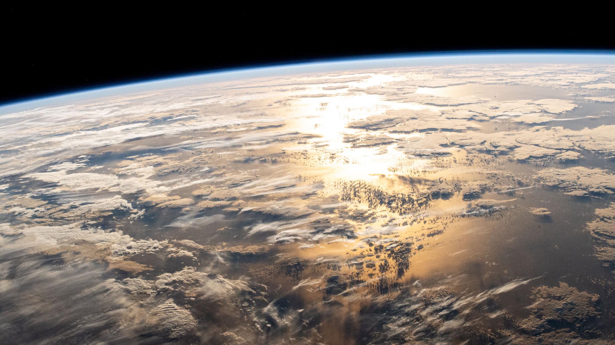 Space engineer mom sees physics in sun glint.